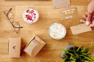 Close Up Of Man Running Online Business Making Boutique Candles At Home With Digital Tablet